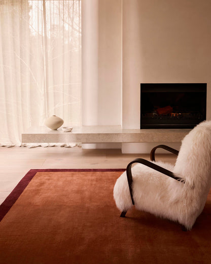 Minimalist Terracotta and Maroon Border Rug